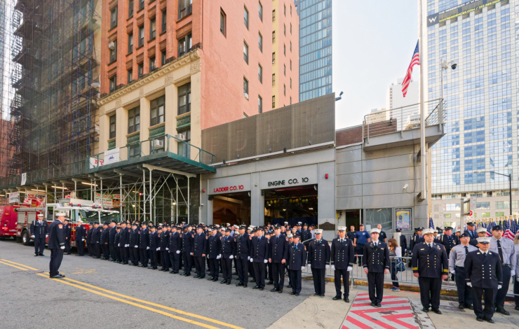 At the Ladder 10, Engine 10 firehouse on Liberty Street, firefighters stand at attention before a moment of silence. The “10 House” lost six firefighters on 9/11. Photo: Carl Glassman/Tribeca Trib